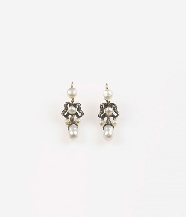 A pair of natural saltwater pearl pendant earrings