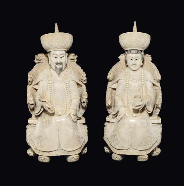 A pair of carved ivory emperors seated on throne, China, Qing Dynasty, 19th century