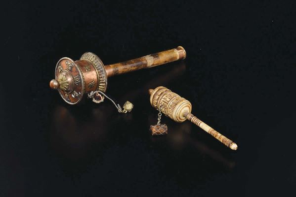 Two prayer wheels, a carved ivory and a copper one, Tibet, 19th century