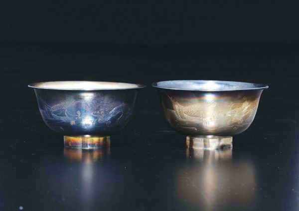Two silver phoenix and dragon cups, China, Qing Dynasty, 19th century