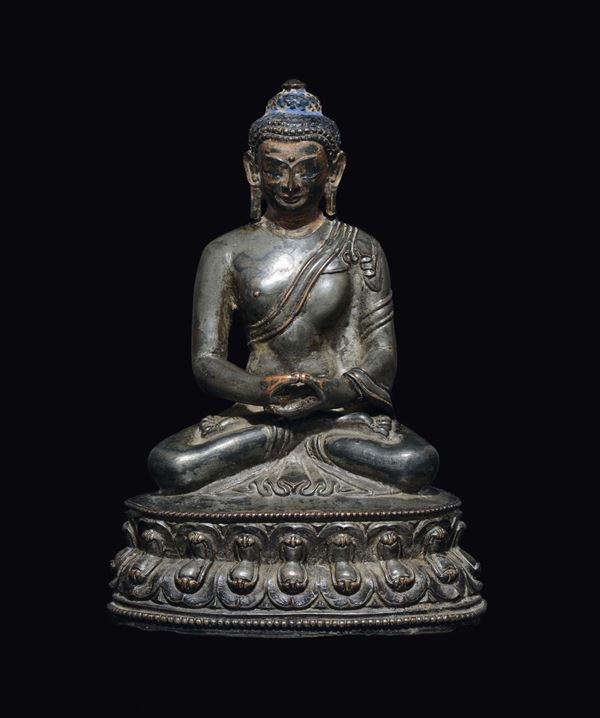 A silver-bronze figure of Sakyamuni Buddha on a double lotus flower, China, Ming Dynasty, 16th century