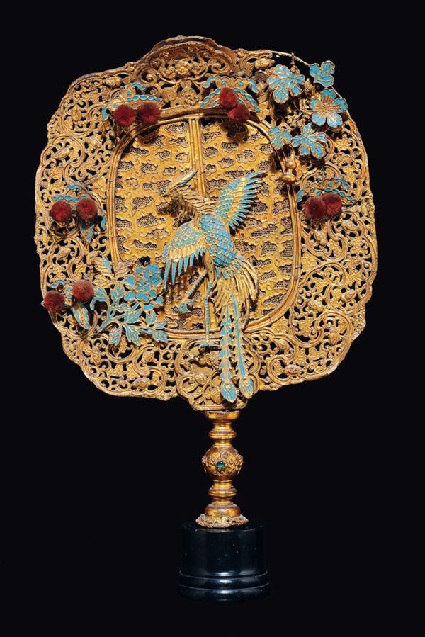 A gilt-lacquered wooden and papier maché fan with enamelled figure of phoenix, China, Qing Dynasty, 18th century
