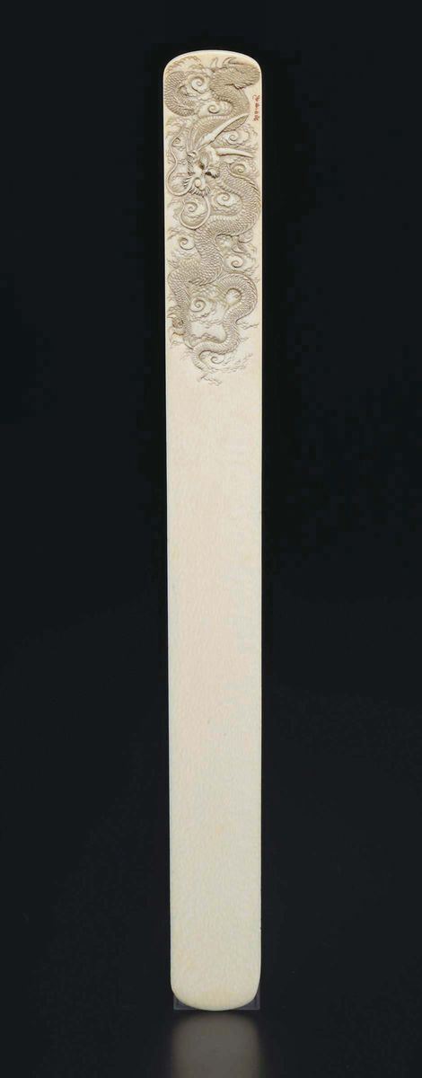 A carved ivory paper knife with dragon and inscription, China, early 20th century