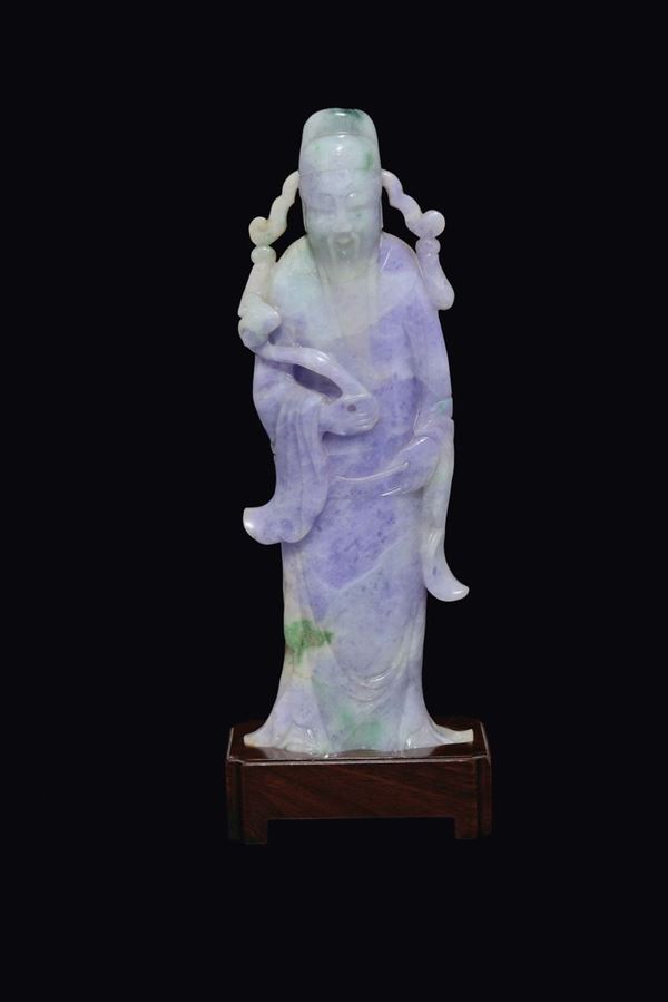 A green and lavender jadeite figure of dignitary with ruyi, China, Qing Dynasty, 19th century
