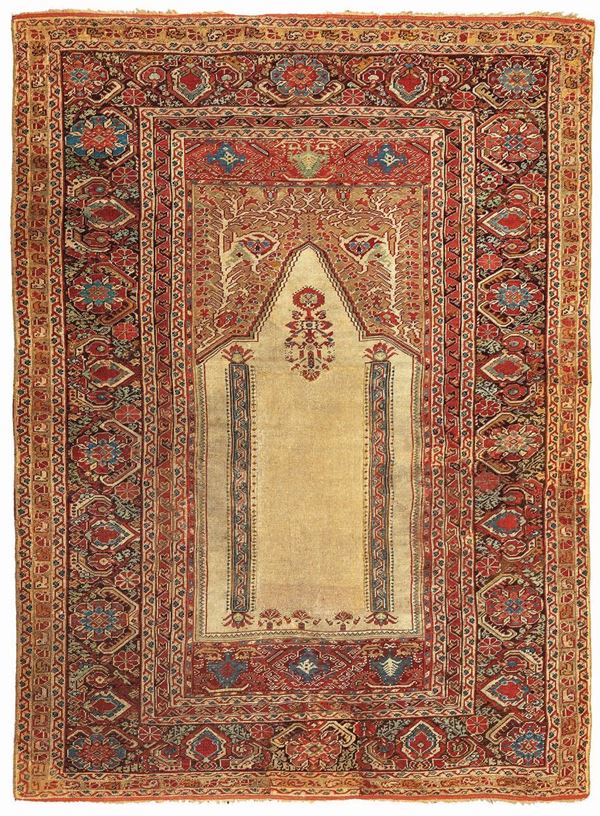 A Ghiordes prayer rug late 18 early 19 century cm 173x134. Sides not originally.