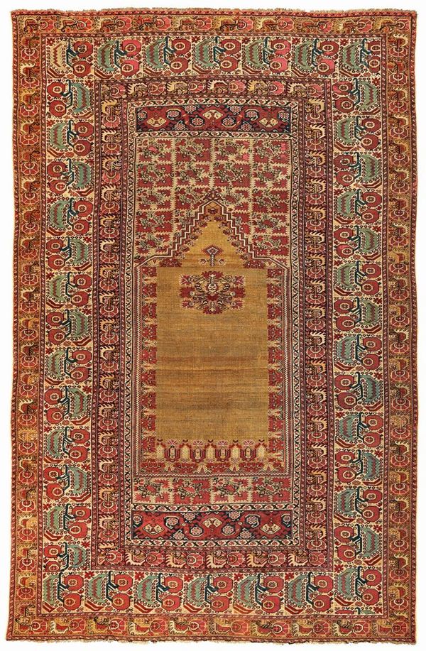 A Ghiordes prayer rug 19th century cm 238x154. Sides not originally.
