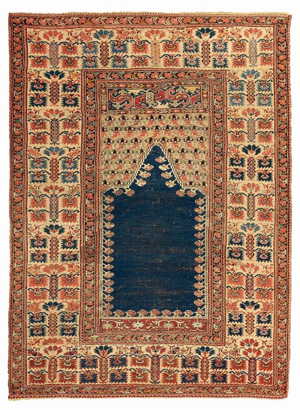 A Ghiordes rug West Anatolia late 18th early 19th century cm 175x132. Sides not originally.
