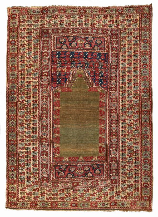 A Ghiordes rug West Anatolia early 19th century cm 190x140. Sides not originally
