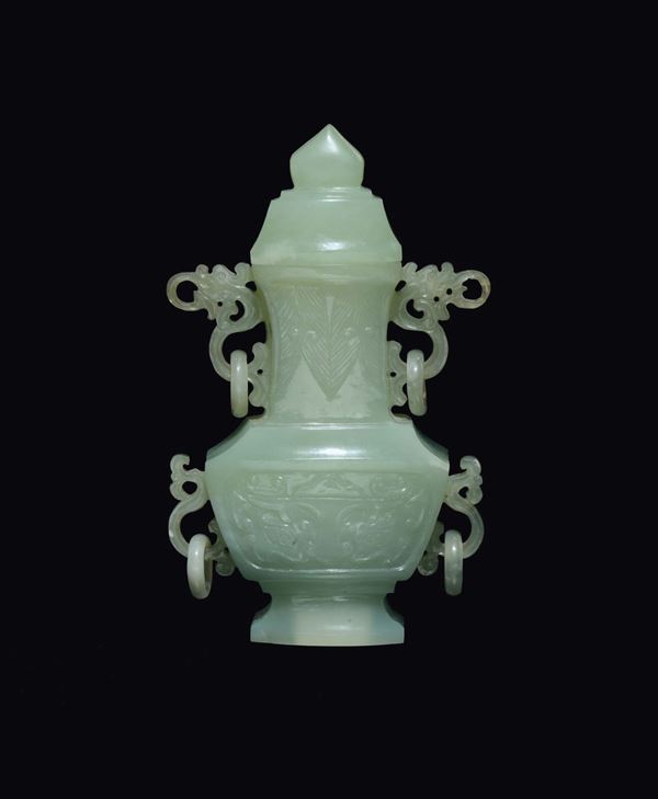 A green jade ring-handles vase and cover with archaic style decoration, China, 20th century