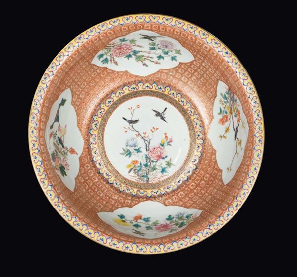 A large polychrome enamelled porcelain bowl with flowers within reserves, China, Qing Dynasty, Gunagxu Period (1875-1908)