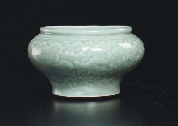 A Celadon porcelain vase with floral decoration, China, Qing Dynasty, 19th century