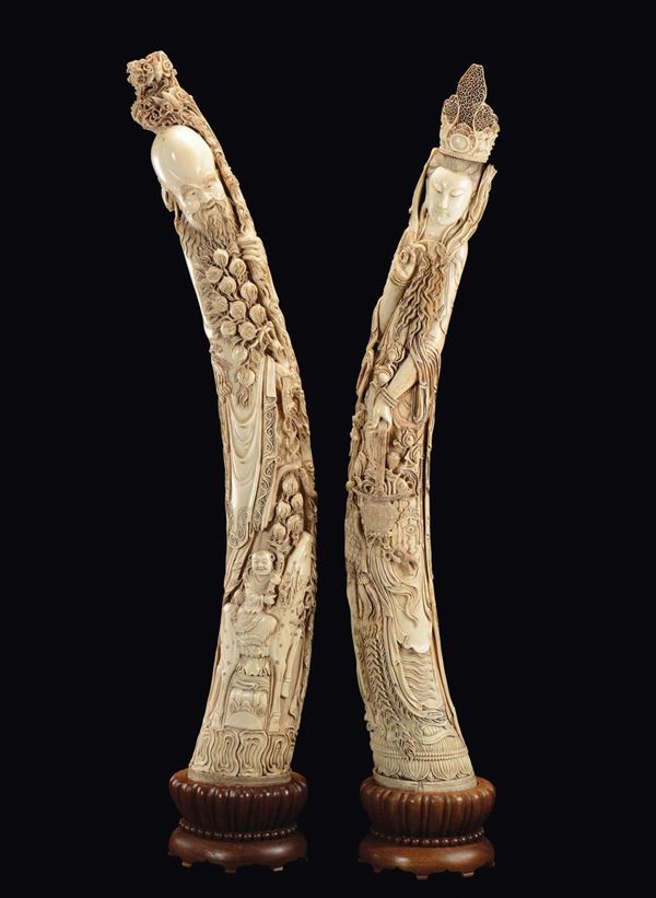 A piar of large carved ivory figures, Guanyin and Shoulao, China, early 20th century