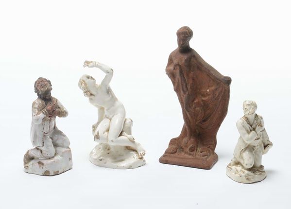 Tre statuine in maiolica bianca ed una in terracotta