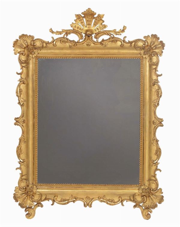 Grande specchiera riccamente intagliata e dorata, XIX secolo