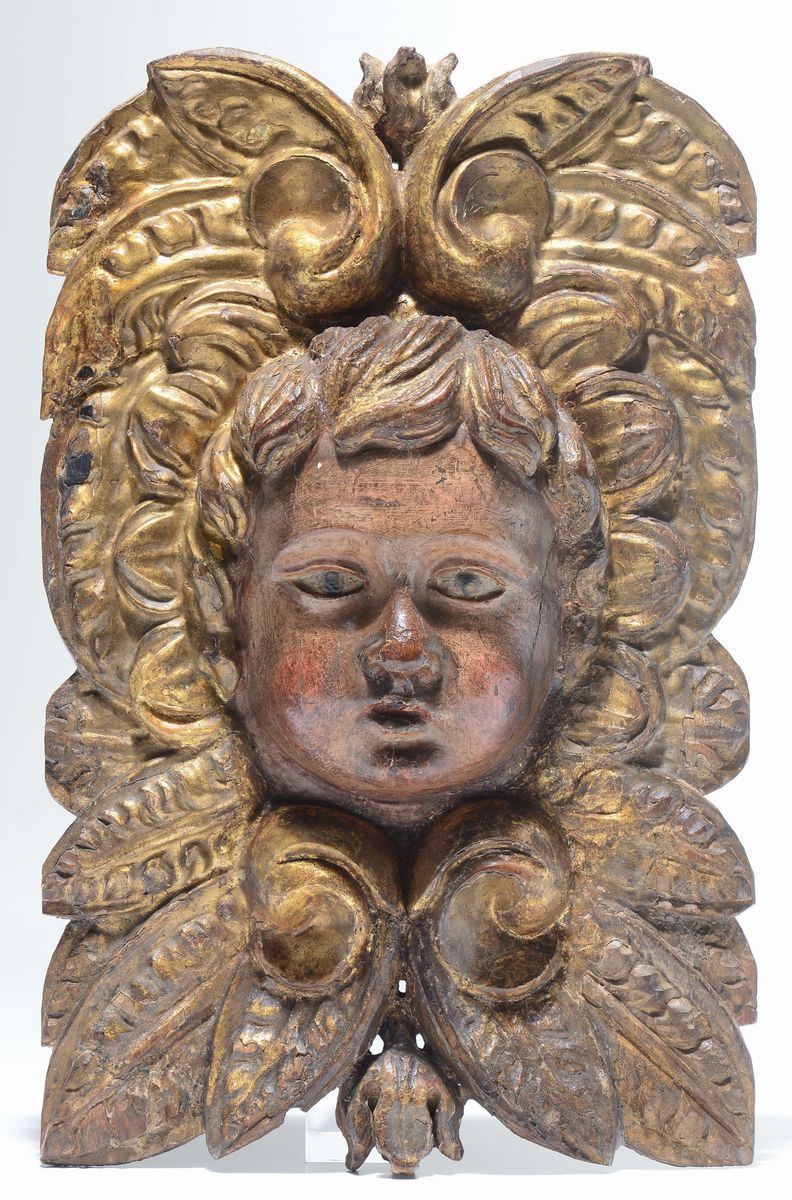 Placca da muro in legno intagliato e dorato con testa di angioletto, XVIII secolo  - Asta Antiquariato - Cambi Casa d'Aste
