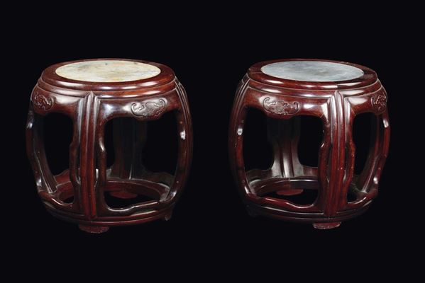 A pair of carved wood stools with bats in relief and marble plane, China, Qing Dynasty, 19th century