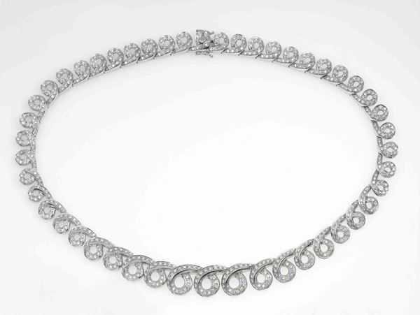 Damiani. A diamond and gold necklace