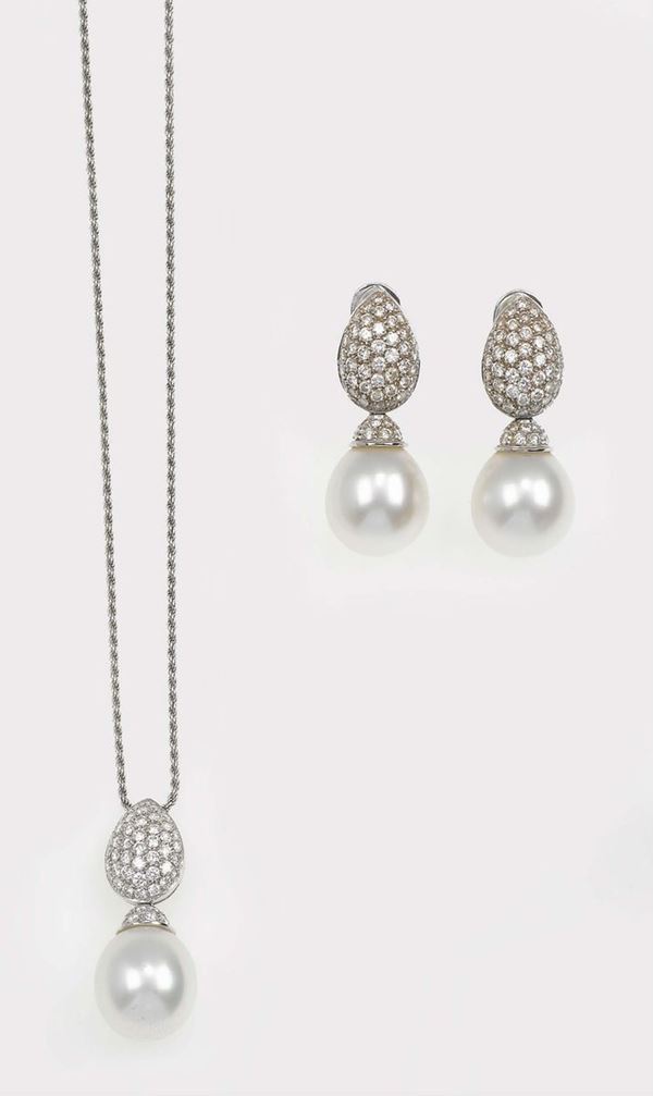Cultured pearl and diamond demi-parure comprising a pendant and a pair of earrings