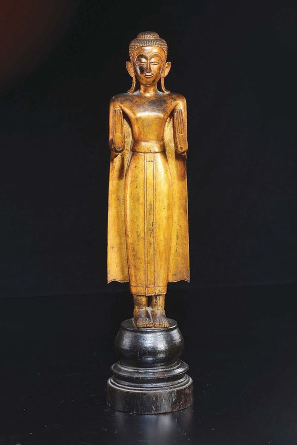 A lacquered wood figure of standing Buddha, Thailand, 19th century