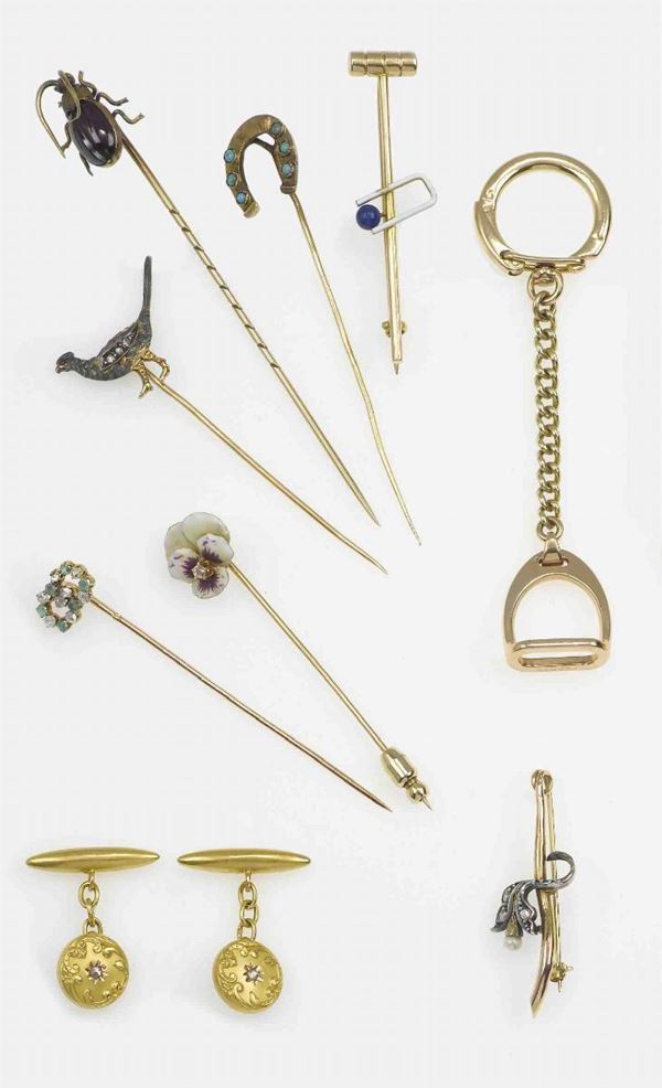 Lot composed by five tie pins, two brooches, a pair of cufflinks and a gold, silver, enamel and gem-set keychain
