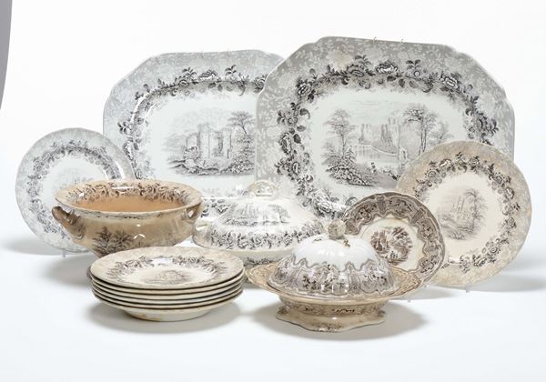 Numerosi piatti e pezzi di servizio decorati a decalcomania