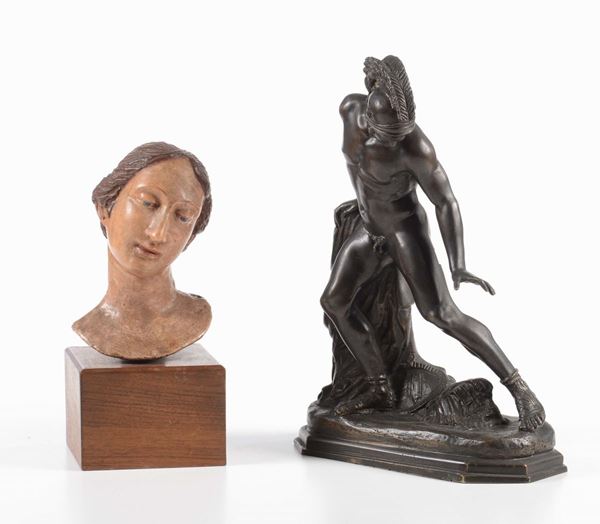 Scultura in bronzo e testa da presepe in terracotta