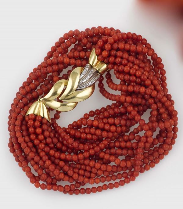 A coral, gold and diamond necklace