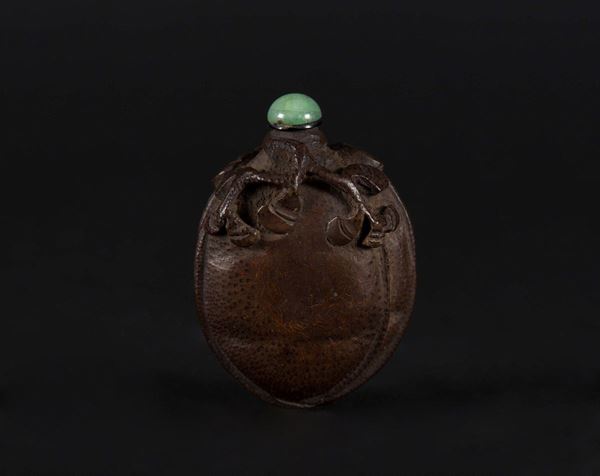 A fruit wood seed snuff bottle, China, 20th century