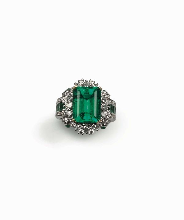 A Colombian emerald and diamond ring. R.A.G report