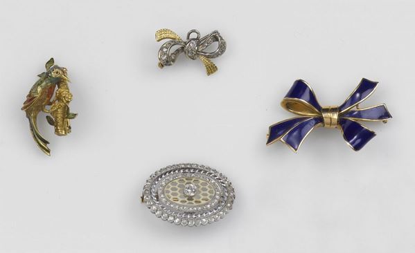 Lot composed by four gold, silver and gem-set brooches