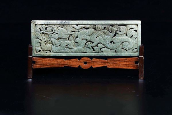 A green and russet jade plaque with dragons, China, Qing Dynasty, 19th century