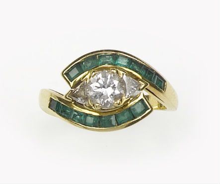 A diamond and emerald cluster ring