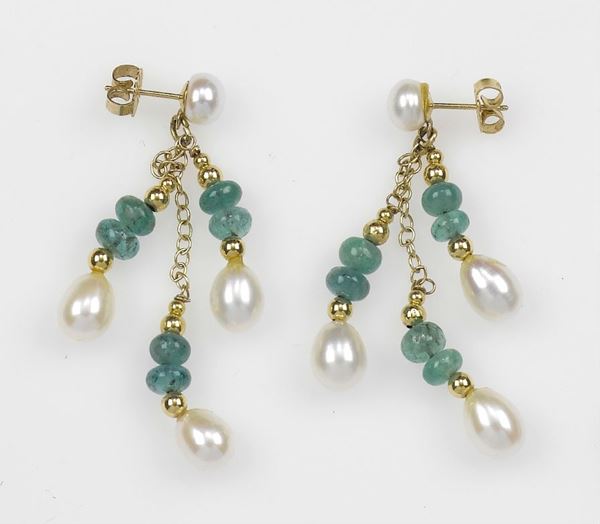 A pair of pearl and emerald earrings