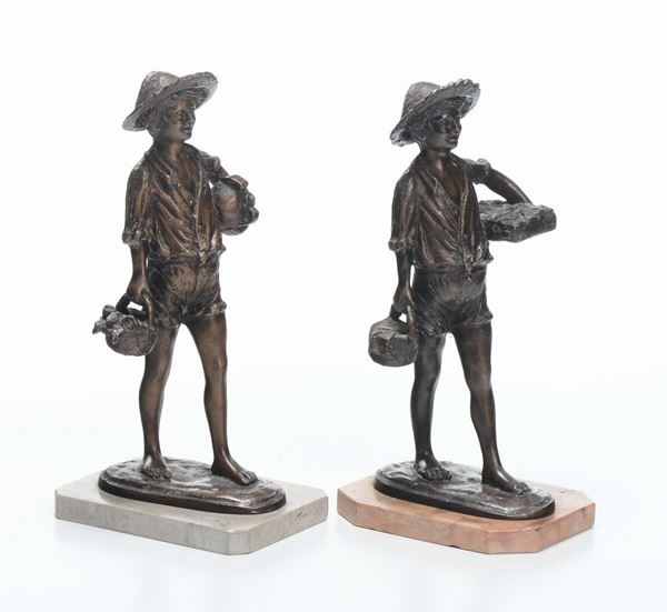 Due fanciulli in bronzo, firmati Di Giacomo