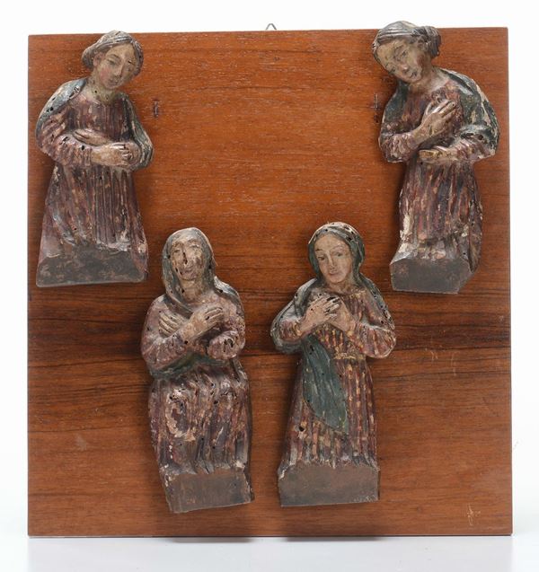 Quattro piccole sculture in legno policromo raffiguranti Sante, XIX secolo