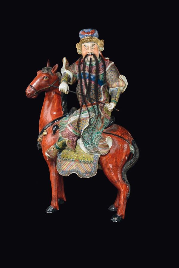 A polychrome enamelled porcelain figure of a warrior on a horse, China, Republic, 20th century