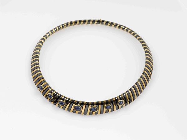 A sapphire, gold and metal necklace