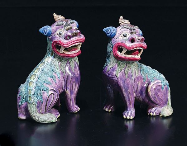 A pair of polychrome enamelled porcelain figure of Pho dogs, China, Qing Dynasty, 19th century