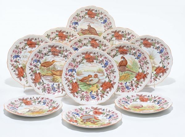Servizio di piatti caccia e pesca in porcellana policroma, XX secolo