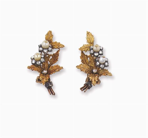 A pair of gold and pearl earrings. Buccellati