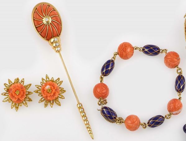 A group including a bracelet, a pins and a pair of earrings with coral, gold and enamel
