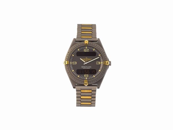 BREITLING, AEROSPACE, TITANIUM AND GOLD, case No. 80360, two time zone, water-resistant, titanium quartz wristwatch with timer, chronograph to 1/100th seconds, alarm and an integrated titanium and gold link bracelet with deployant clasp. Made in 1985