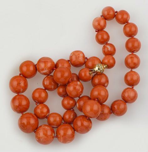 A coral, diamond and gold necklace