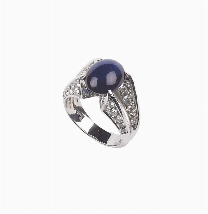 A cabochon-cut sapphire and diamond ring. Kutchinsky  - Auction Fine Jewels - I - Cambi Casa d'Aste