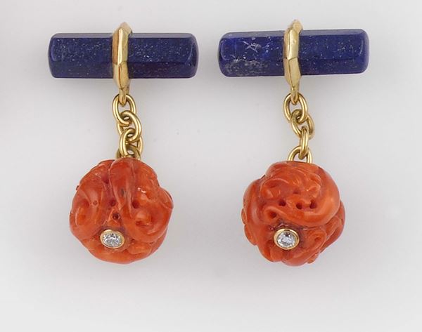 A pair of carved coral, lapis and gold cufflinks
