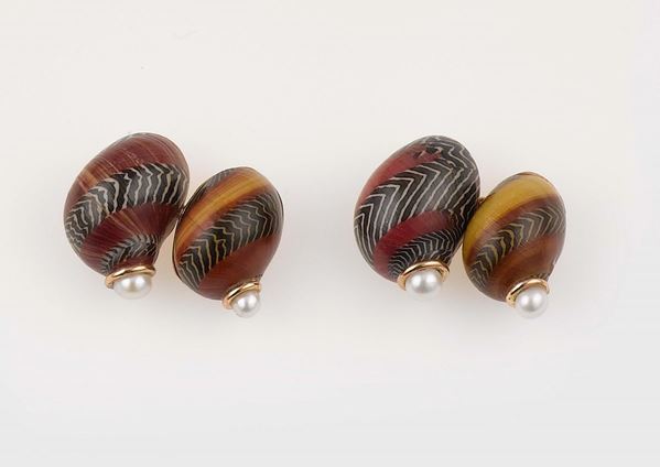 A pair of enamel and pearl cufflinks