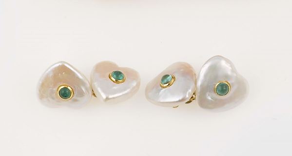 A pair of pearl and emerald cufflinks