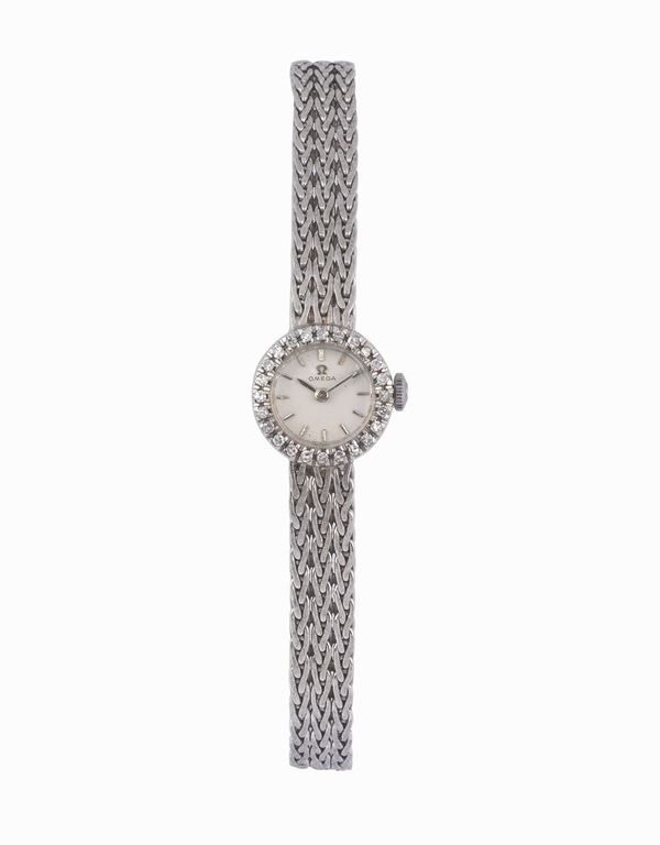 OMEGA, movimento No. 18936509, orologio da polso, da donna, in oro bianco 18K e brillanti con bracciale rigido in oro bianco. Realizzato nel 1960 circa