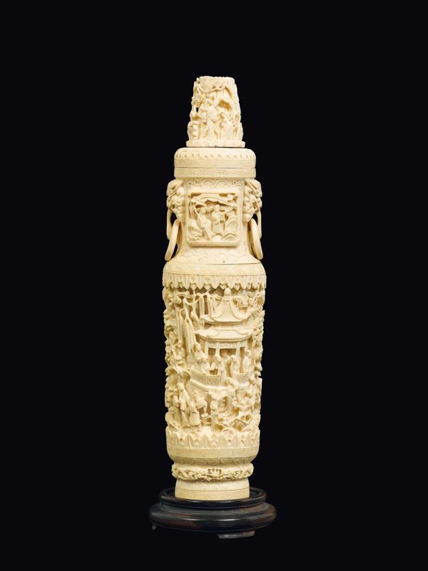 A carved ivory vase and cover with ring-handles and common life scenes in relief, China, Qing Dynasty, 19th century