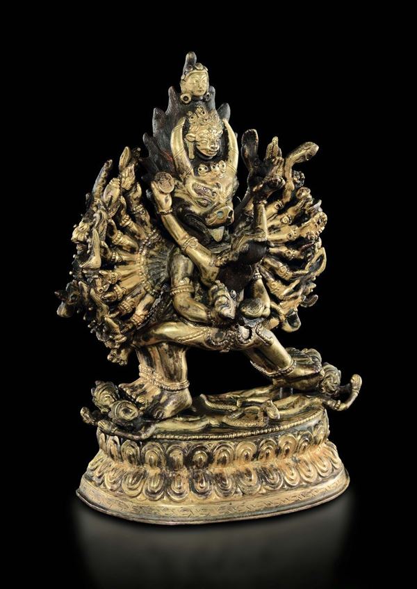 A gilt bronze figure of Vajrabhairava in Yab Yum with wife on a double lotus flower, Tibet, 19th century